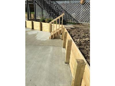 retaining-walls-with-support-beams-and-stairs.jpg