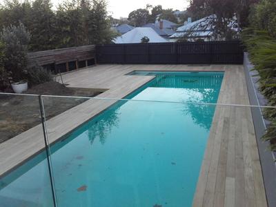 pool-area-with-glass-fence-and-wooden-deck.jpg