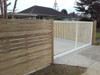 wood-plank-fencing-with-metal-gate.jpg