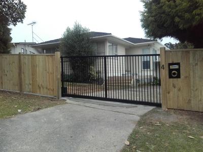 standard-wooden-fence-with-metal-gate.jpg