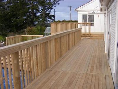 wooden-deck-with-deck-railings-and-stairs.jpg